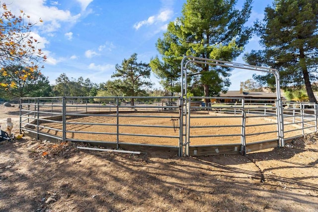 view of stable featuring a rural view