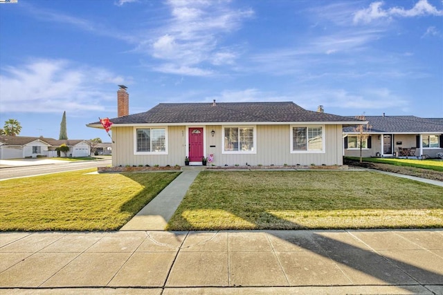 ranch-style house with a front lawn