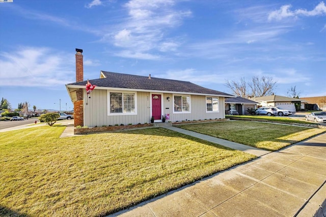 ranch-style house with a front lawn