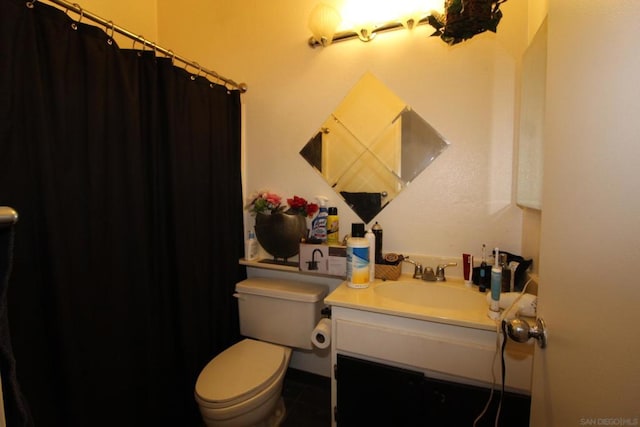 bathroom featuring vanity and toilet