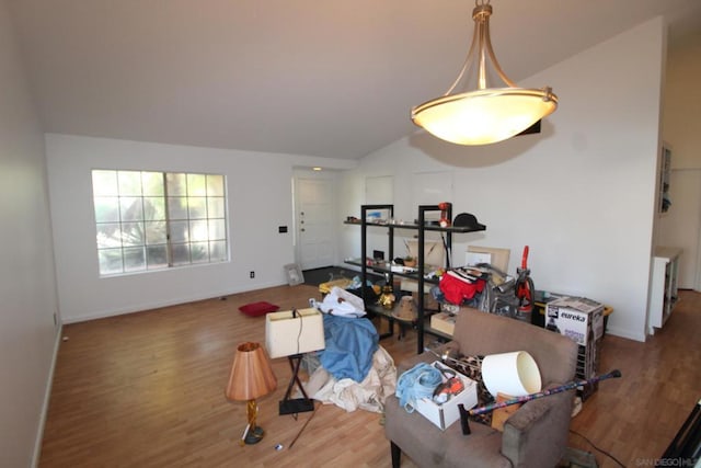 dining room featuring hardwood / wood-style floors and vaulted ceiling