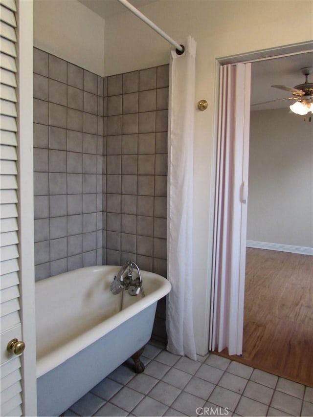 bathroom with ceiling fan, shower / tub combo with curtain, and tile patterned flooring