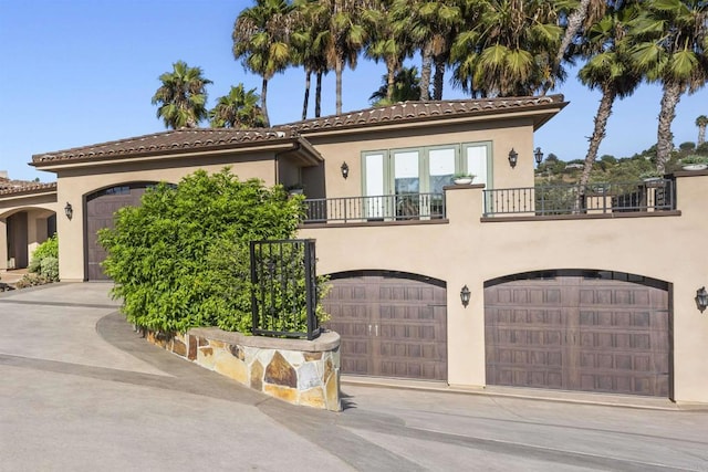 mediterranean / spanish-style home featuring a balcony