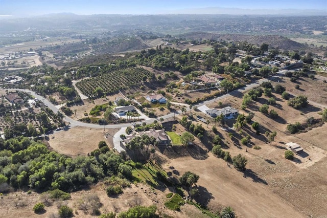 birds eye view of property with a rural view