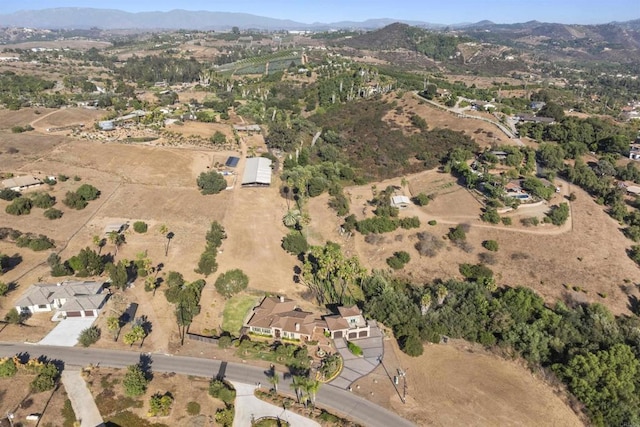 drone / aerial view featuring a mountain view