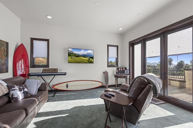 living room with dark colored carpet