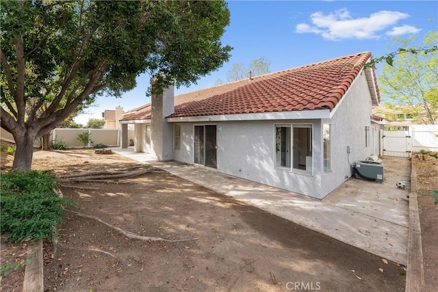 back of house with a patio area