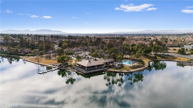 drone / aerial view with a water and mountain view