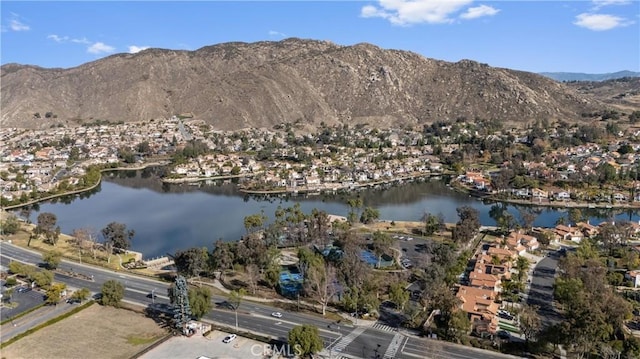 birds eye view of property featuring a water and mountain view