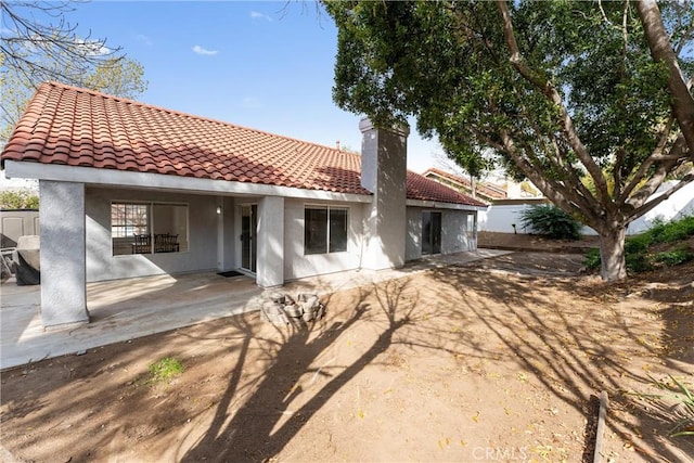 back of property featuring a patio area