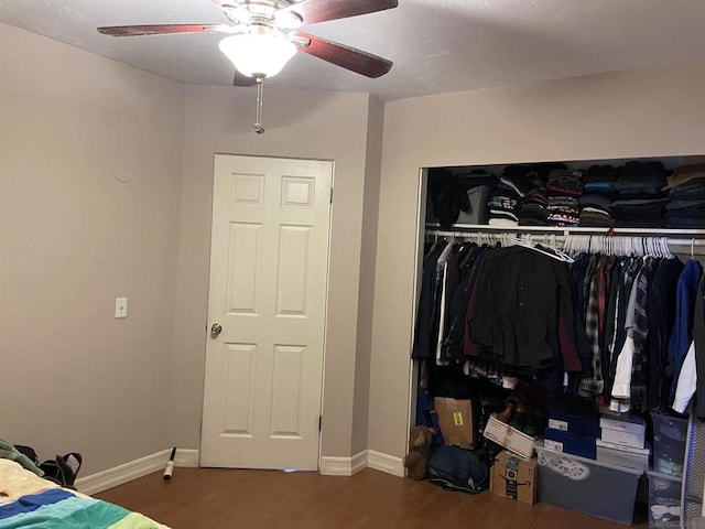 bedroom featuring hardwood / wood-style floors, a closet, and ceiling fan