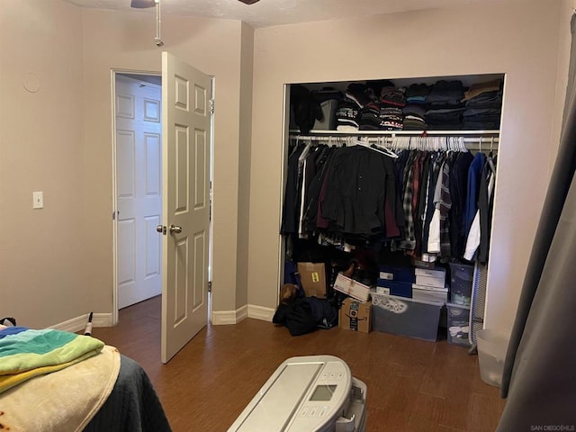 bedroom featuring dark hardwood / wood-style flooring and a closet