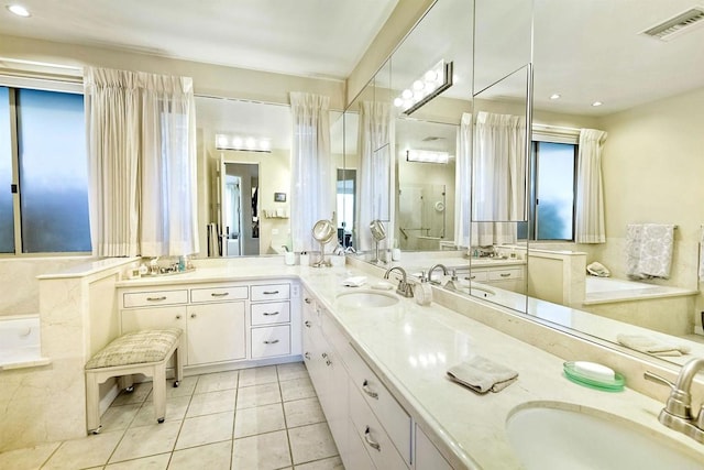 bathroom featuring vanity, an enclosed shower, and tile patterned floors