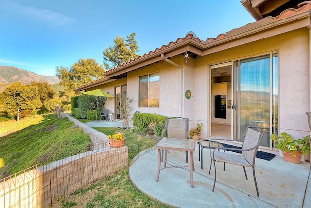 view of patio / terrace featuring a mountain view