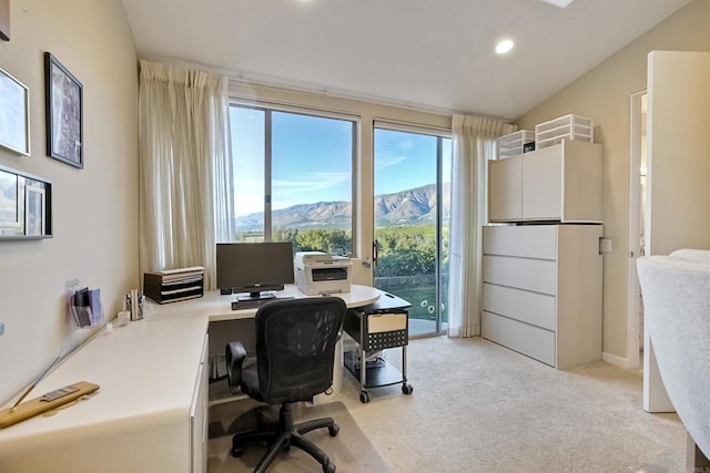 carpeted office space with lofted ceiling