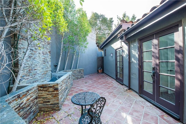 view of patio featuring french doors