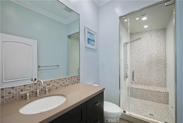 bathroom featuring tasteful backsplash, vanity, toilet, and walk in shower