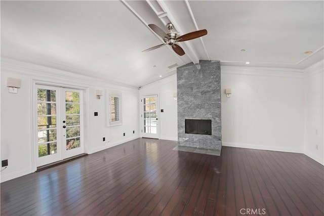 unfurnished living room featuring dark wood-type flooring, a fireplace, french doors, and vaulted ceiling with beams