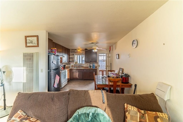 living room with sink and ceiling fan