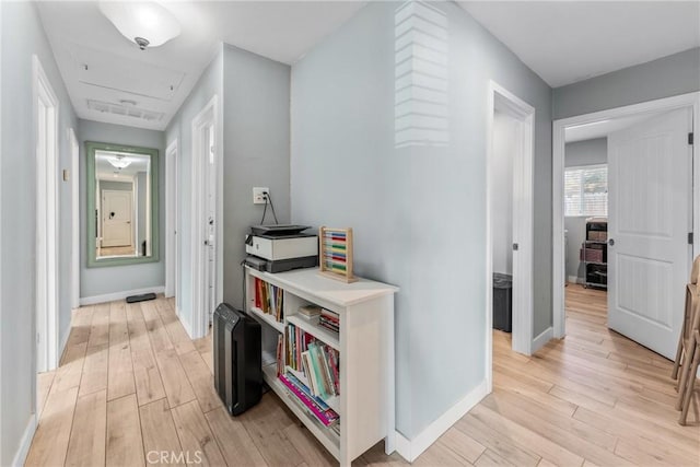 hallway featuring light hardwood / wood-style flooring