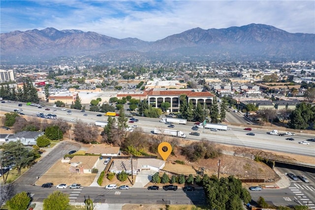 birds eye view of property featuring a mountain view