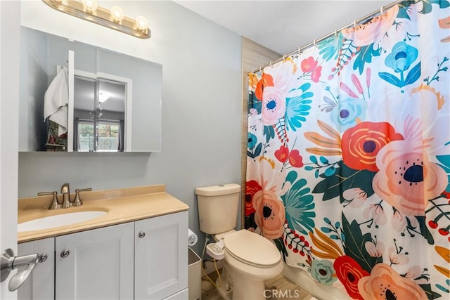 bathroom with vanity, walk in shower, and toilet