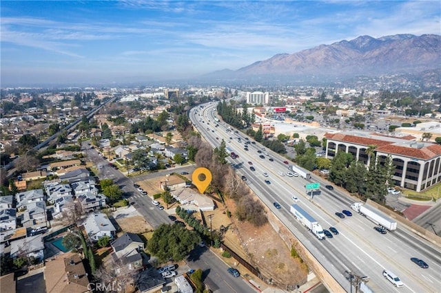 birds eye view of property featuring a mountain view