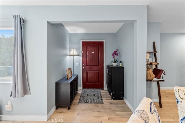 foyer with light hardwood / wood-style floors