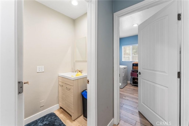 bathroom featuring vanity and hardwood / wood-style floors