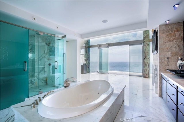 bathroom with vanity, plus walk in shower, and a water view