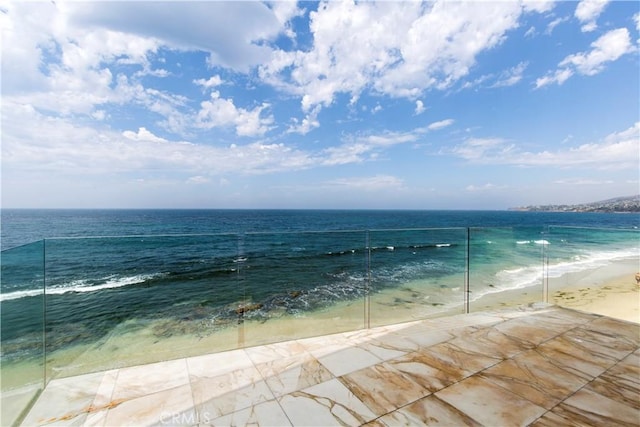 property view of water featuring a beach view