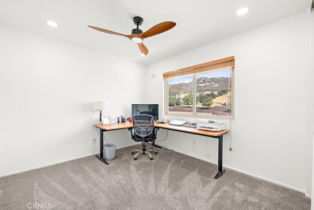 office space featuring carpet and ceiling fan