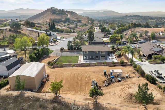 birds eye view of property with a mountain view