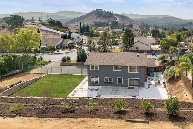 birds eye view of property featuring a mountain view