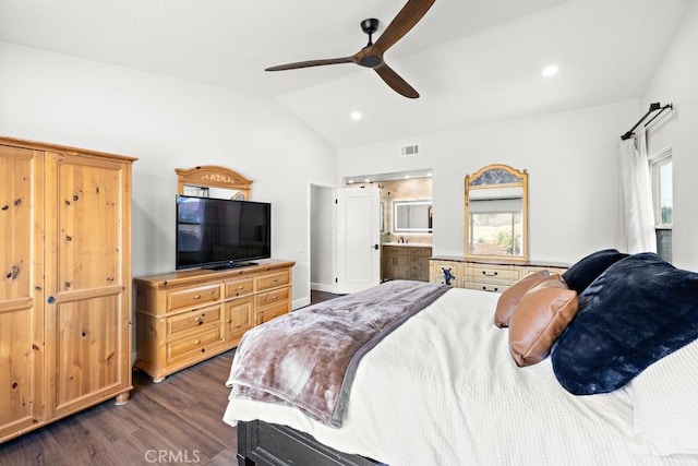 bedroom with ceiling fan, lofted ceiling, dark hardwood / wood-style floors, and ensuite bathroom