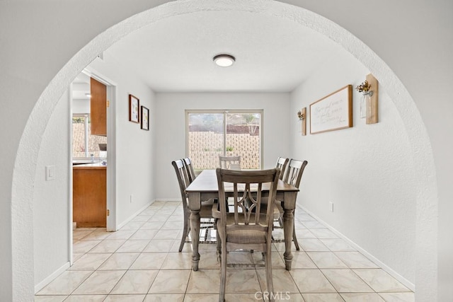 dining area with light tile patterned floors