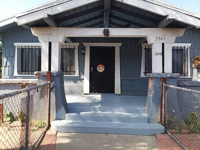 doorway to property with a porch