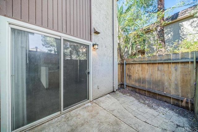 exterior space featuring a patio area and fence