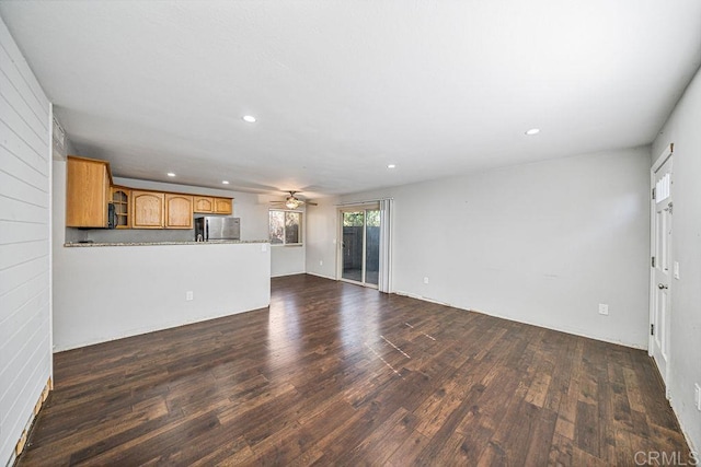 unfurnished living room featuring ceiling fan, dark wood finished floors, and recessed lighting