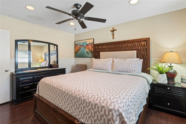 bedroom featuring dark hardwood / wood-style flooring and ceiling fan