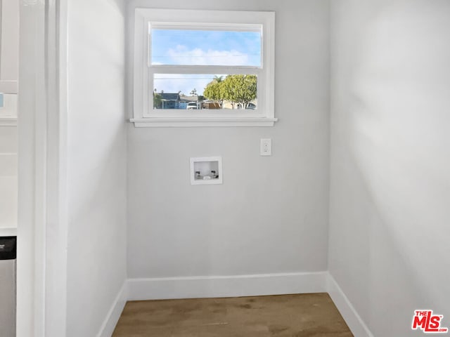 laundry area featuring wood-type flooring and washer hookup