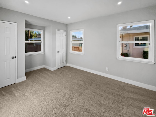 unfurnished bedroom with carpet flooring