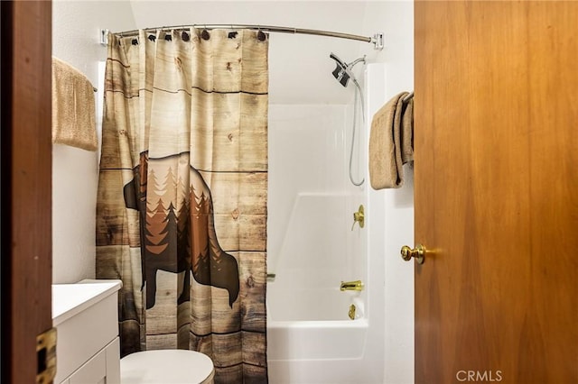 full bathroom featuring vanity, shower / bath combo, and toilet