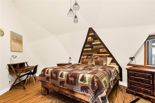 bedroom with wood-type flooring