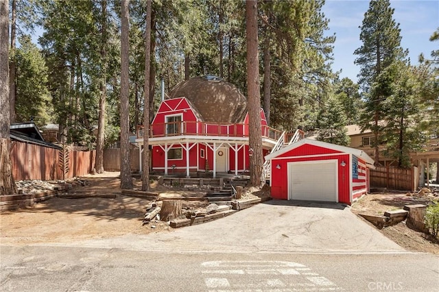 view of front of property with an outbuilding and a garage