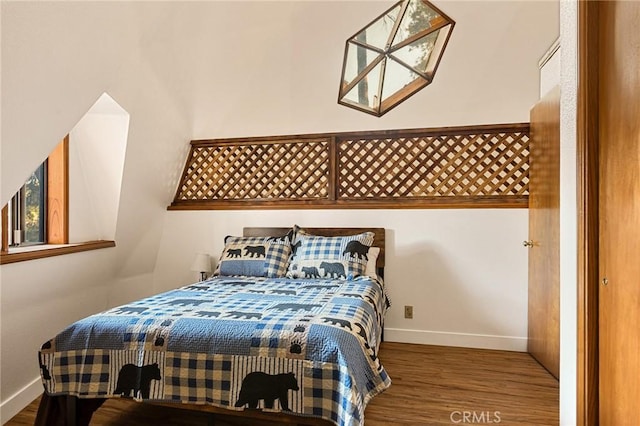 bedroom with hardwood / wood-style floors