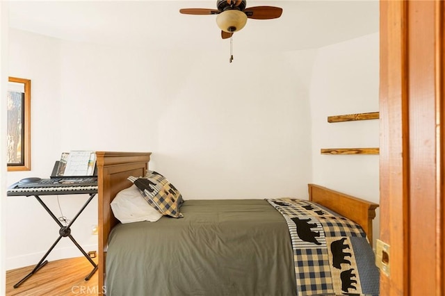 bedroom featuring ceiling fan and wood-type flooring