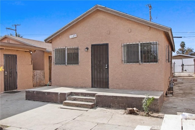 rear view of house featuring a patio