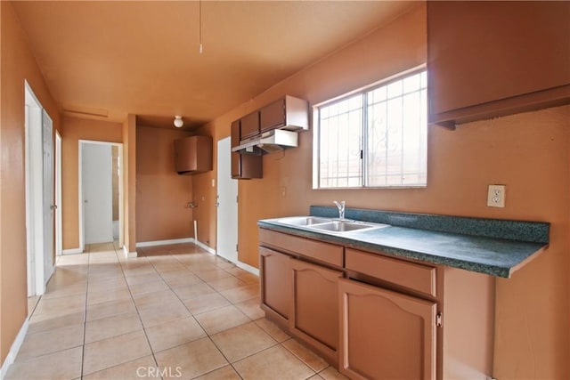 kitchen with sink and light tile patterned floors