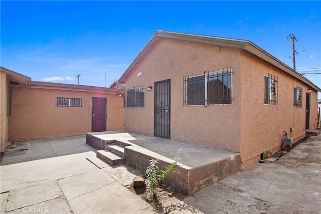 back of property featuring a patio area